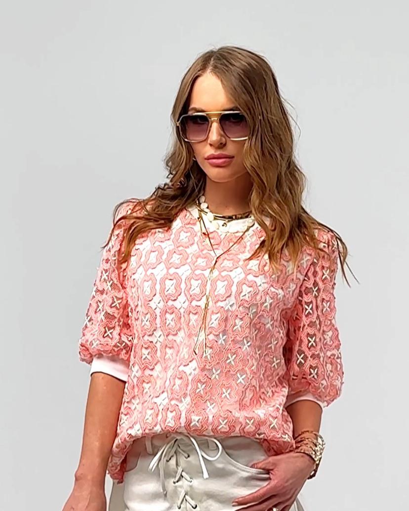 Stylish blouse with coral accents