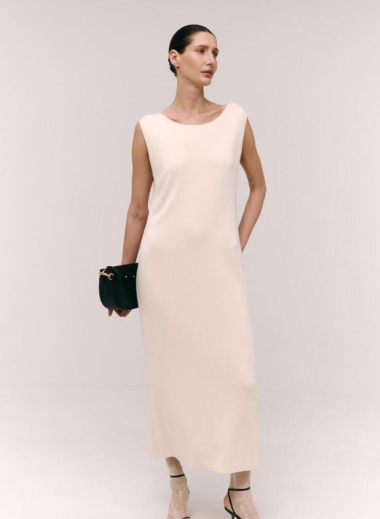 White shimmering sleeveless dress with a boat neckline
