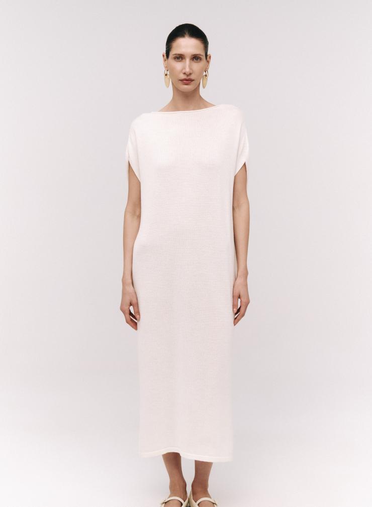 White shimmering dress with a bateau neckline and cap sleeves