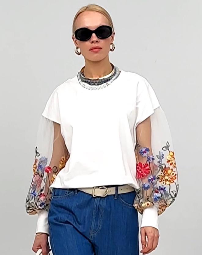 Elegant blouse with embroidered sleeves
